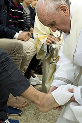 Pope Francis washes the foot of a prisoner at Casal del Marmo youth prison in Rom